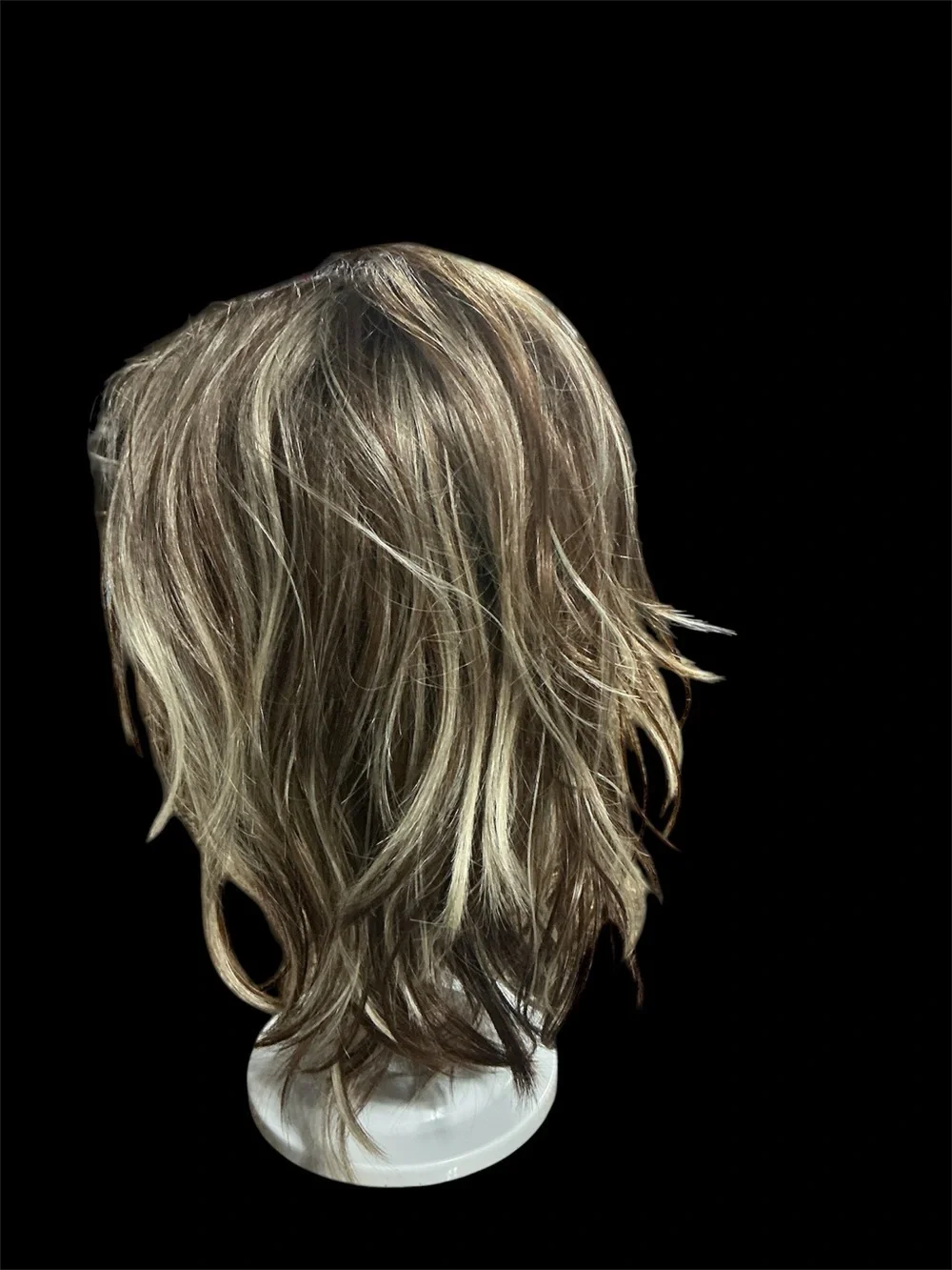 Rene of Paris Natural Layered Women's Wig in Light Brown with Blonde Highlights.